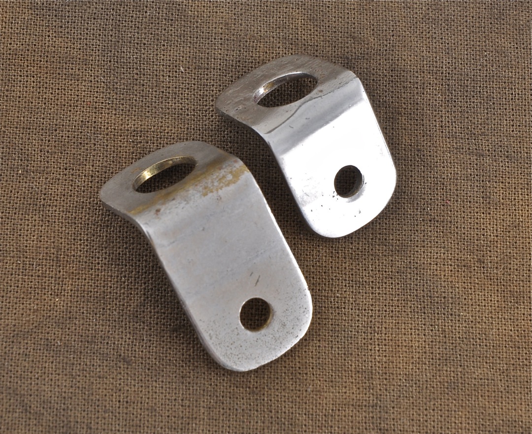 L-R: One-piece flange tailpiece bracket, two-piece flange tail bracket.